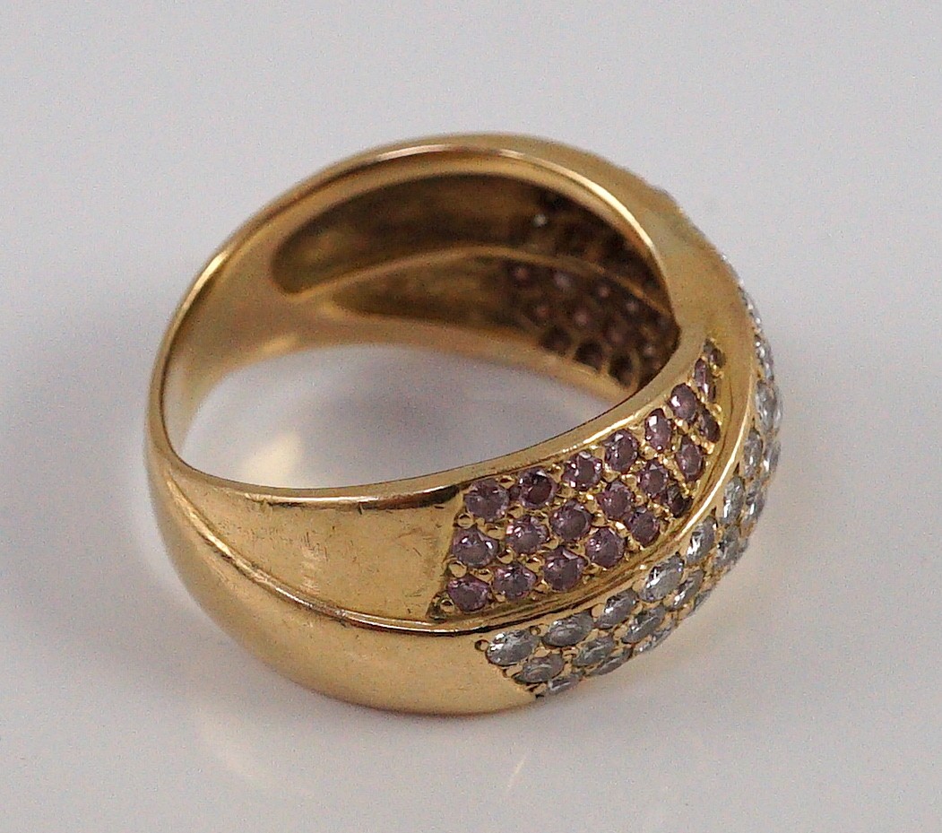 A modern gold (tests as 18ct), pink and white pave set diamond cross over ring, by Musson